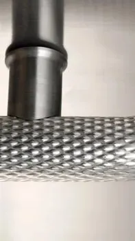 Textured stainless round handrail with returned end