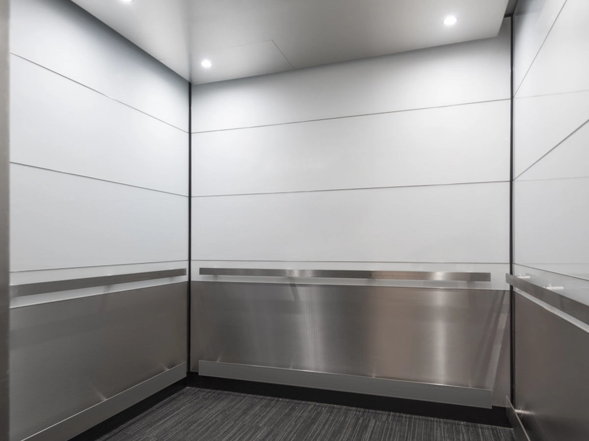 boston-series-elevator-interior-backpainted-white-glass-textured-stainless-11-d-m