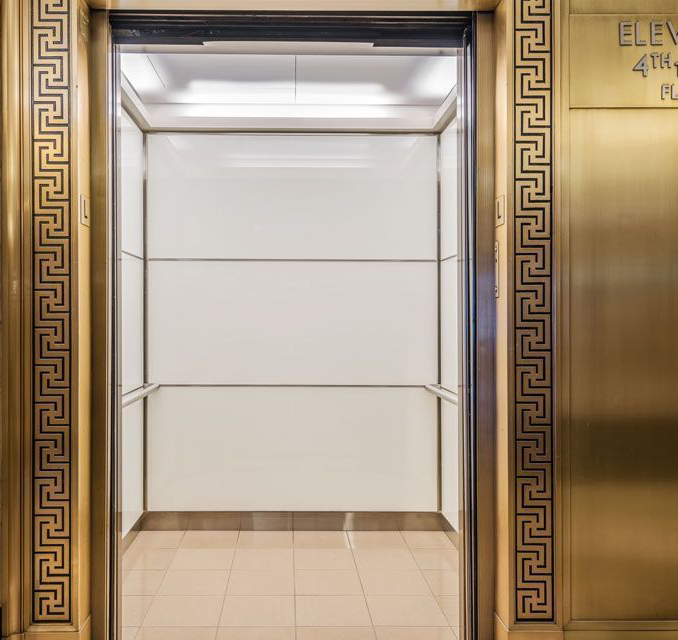 boston-series-elevator-interior-backpainted-white-glass-bronze-surrounds-8