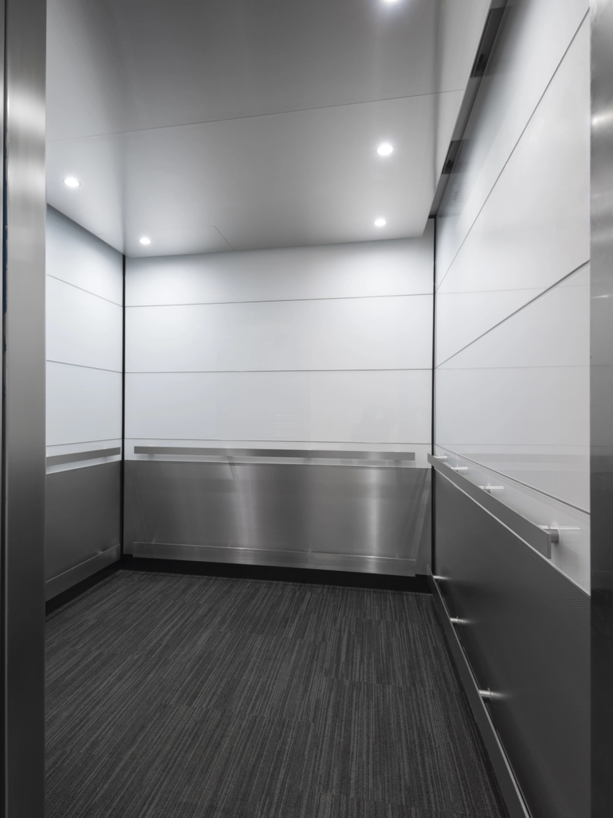 boston-series-elevator-interior-backpainted-white-glass-textured-stainless-7
