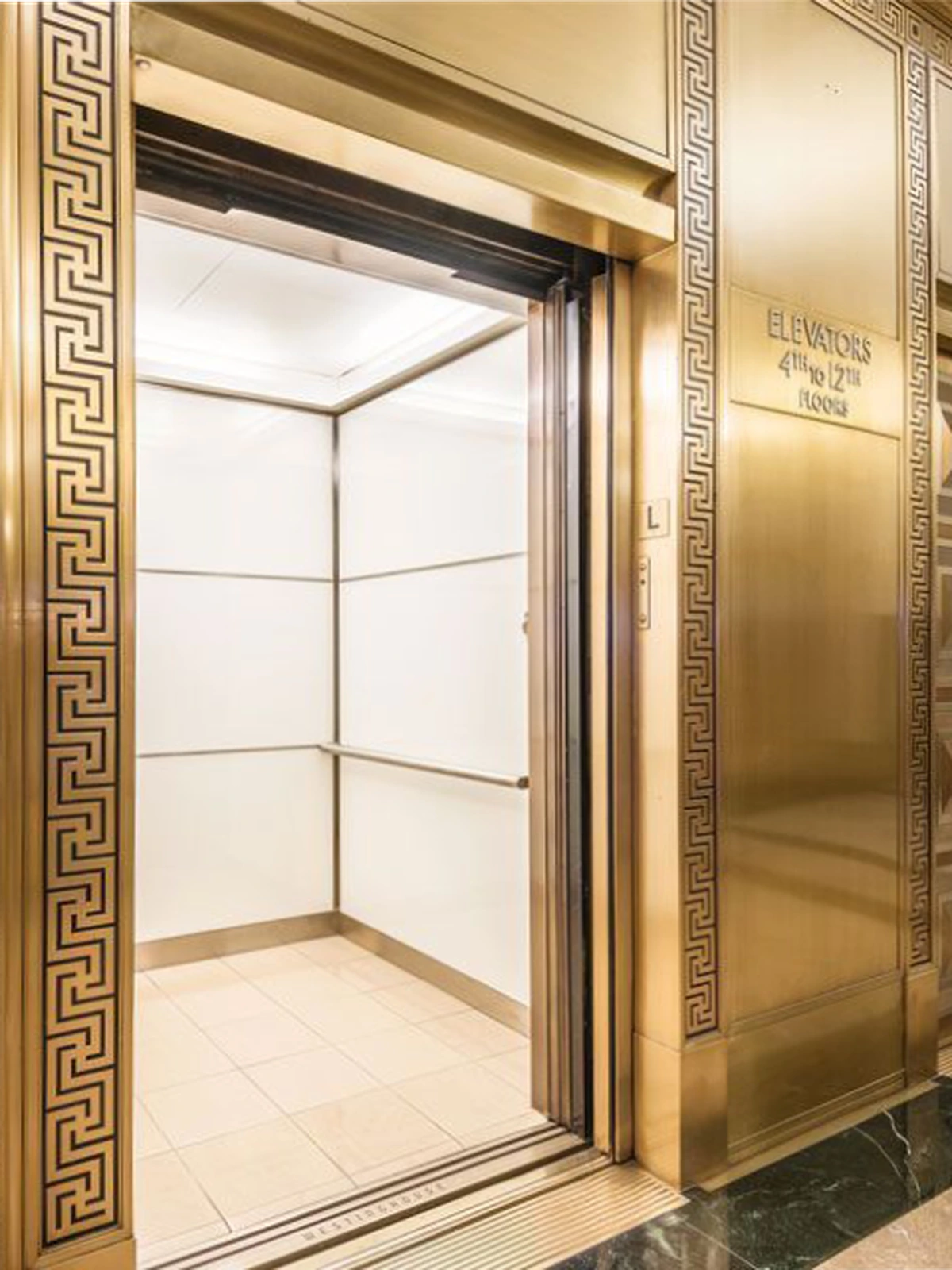 boston-series-elevator-interior-backpainted-white-glass-bronze-surrounds-2