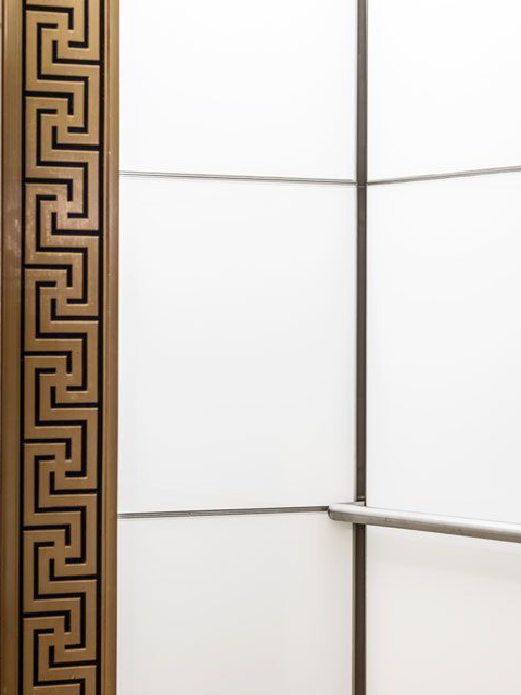 boston-series-elevator-interior-backpainted-white-glass-bronze-surrounds-4