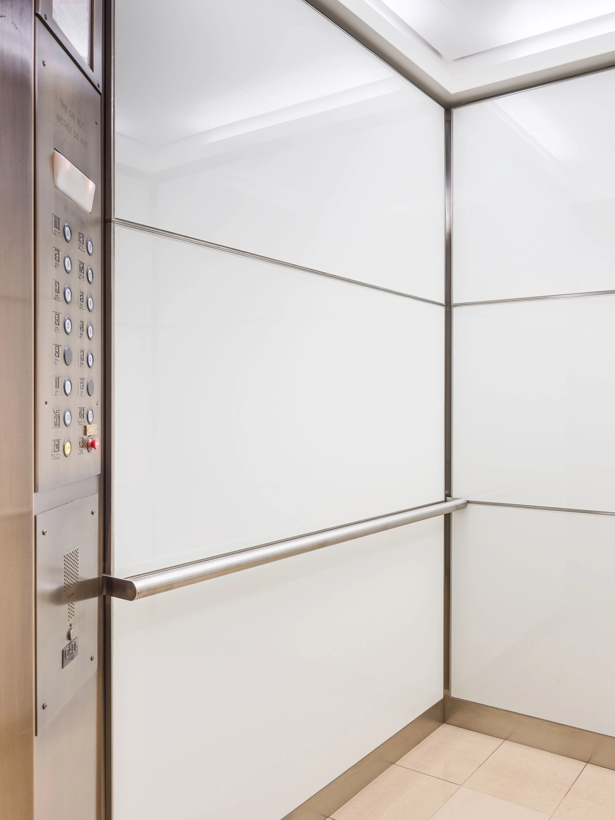 boston-series-elevator-interior-backpainted-white-glass-bronze-surrounds-5