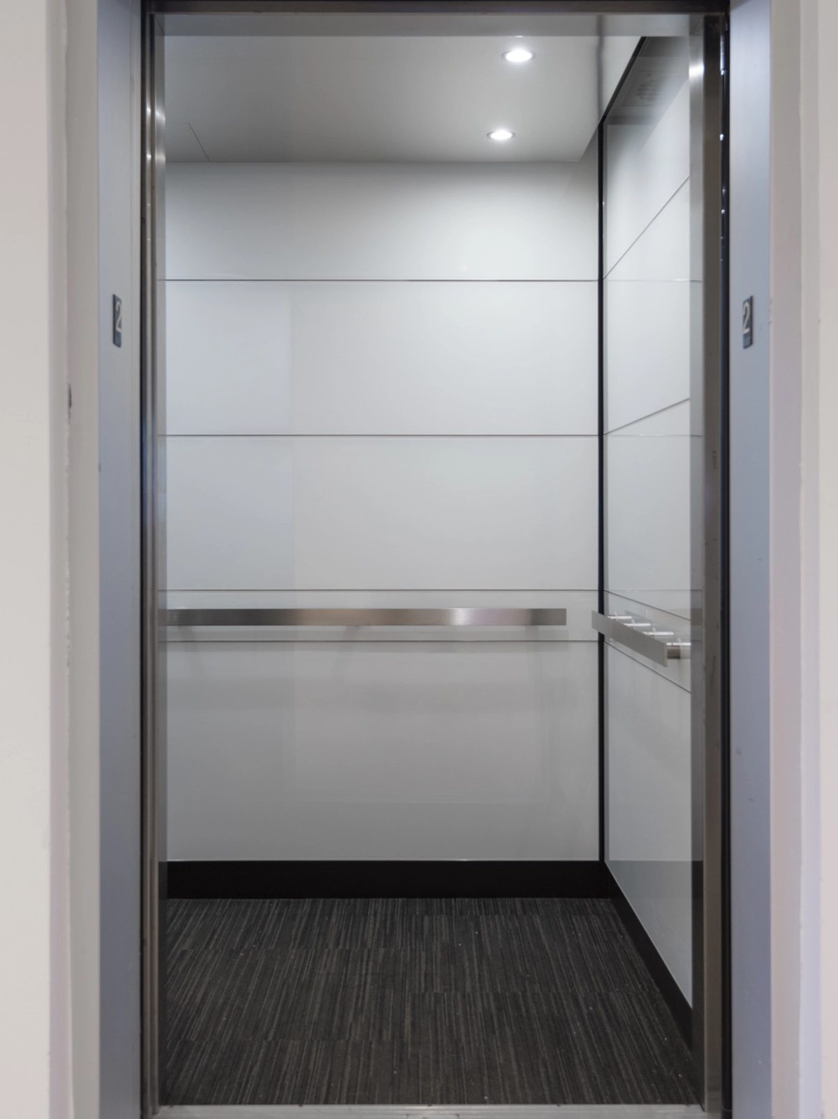 boston-series-elevator-interior-backpainted-white-glass-stainless-frames-2