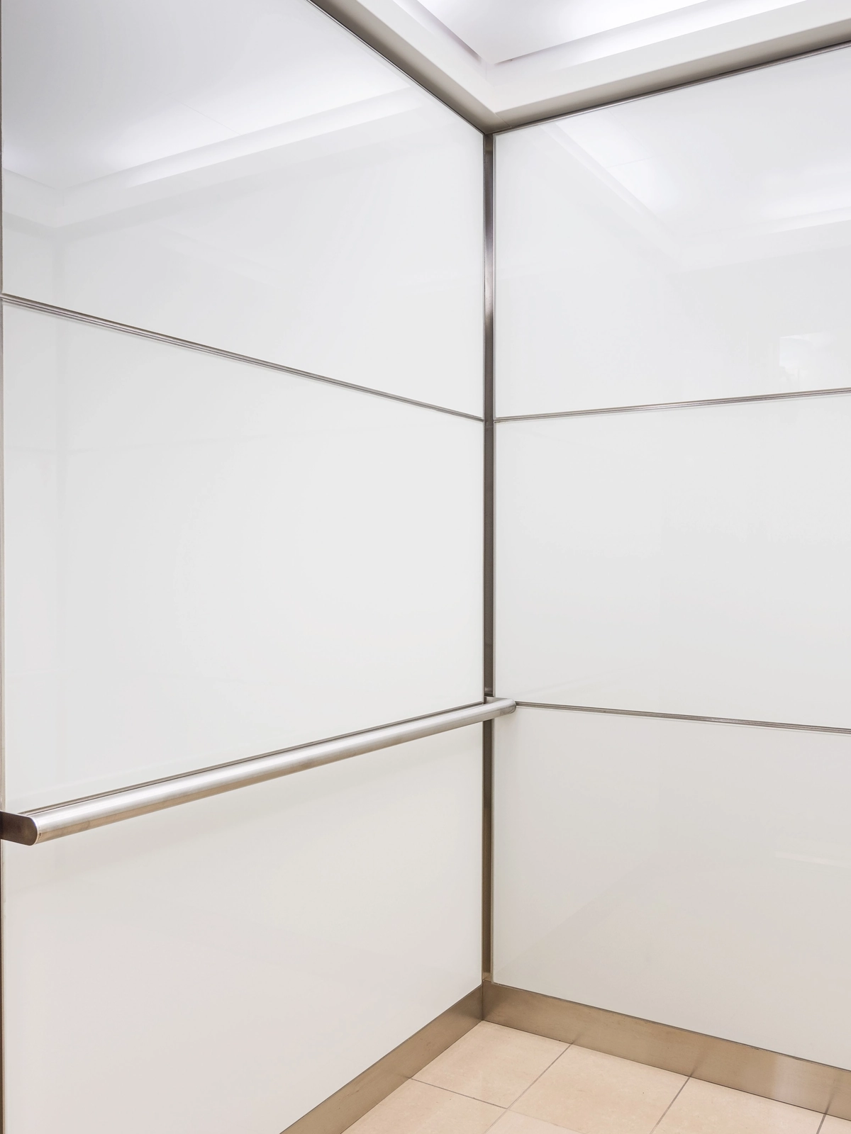 boston-series-elevator-interior-backpainted-white-glass-stainless-frames-7